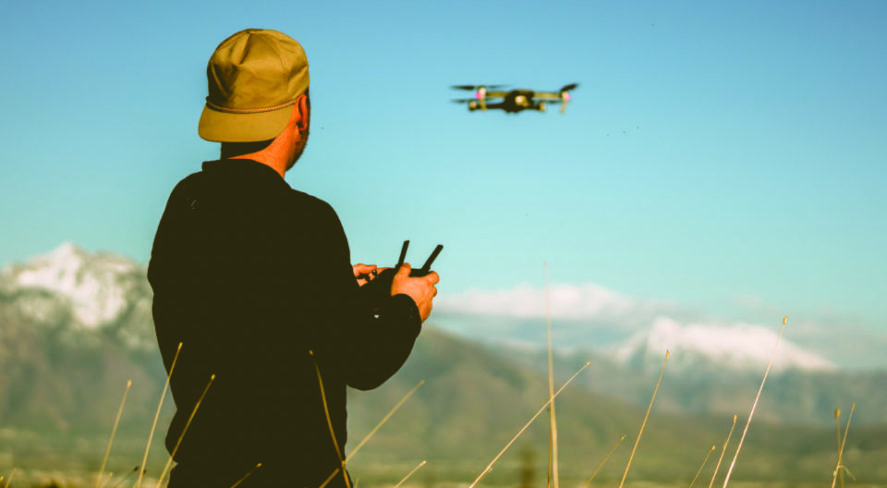 person flying drone