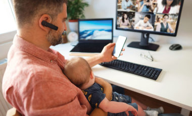 person working from home at computer with baby