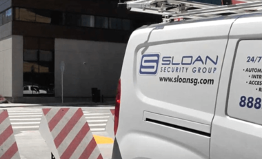 Sloan Security Group logo on van