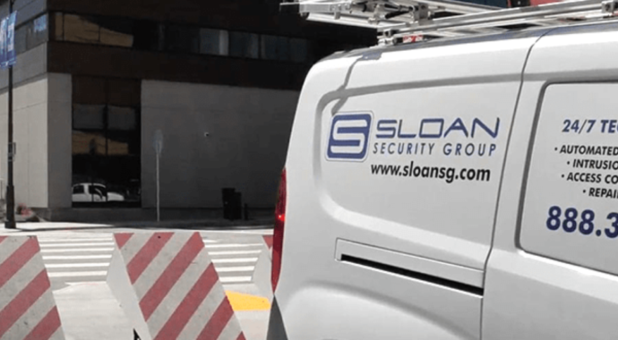 Sloan Security Group logo on van