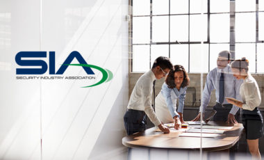 people working together at a table with SIA logo