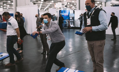 ISC East attendees playing corn hole in the FAST Cornhole Tournament Nov. 17