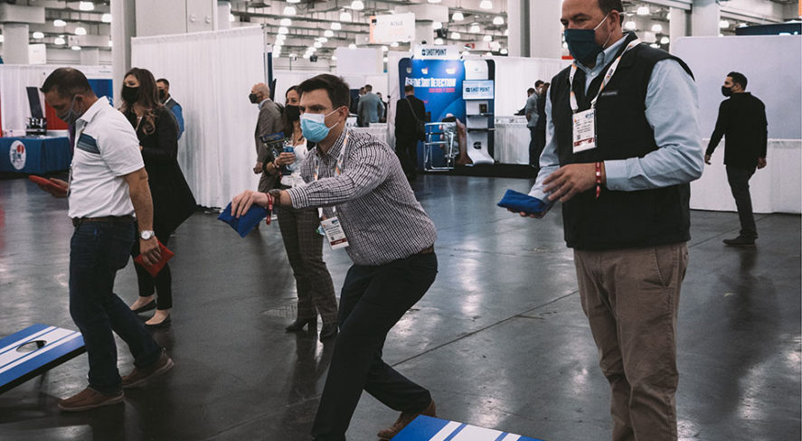 ISC East attendees playing corn hole in the FAST Cornhole Tournament Nov. 17