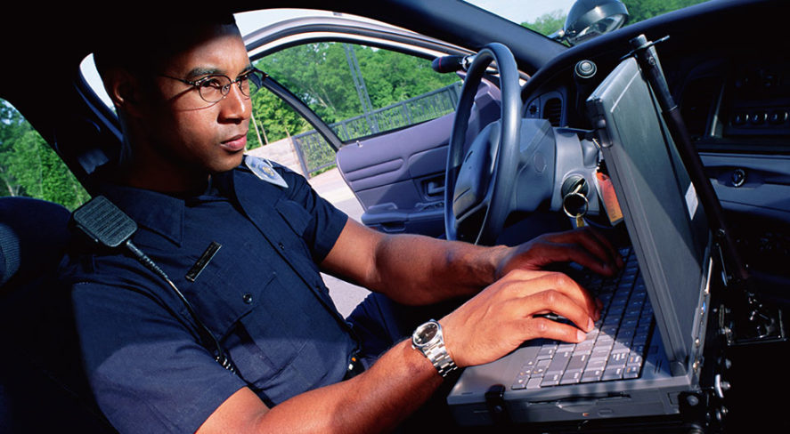 police officer using facial recognition