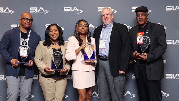 SIA members being honored with the Jay Hauhn Excellence in Partnerships Award at the SIA Market Leaders Reception