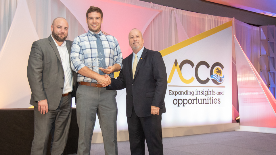 YourSix CTO Jacob Hengel receiving Axis Cloud Provider of the Year award