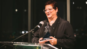 Elaine Palome accepting the 2021 SIA Progress Award