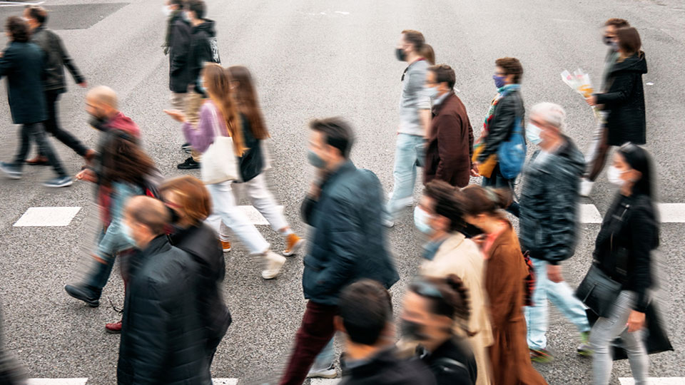 crowd of people wearing masks